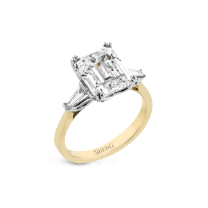 Stunning emerald-cut engagement ring with elegant baguette accents in a two-tone gold setting.