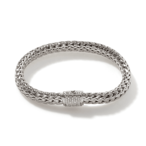Elegant silver bracelet with braided design and sparkling clasp, perfect for any occasion.