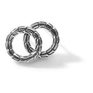 Intertwined silver rings with a chain-link design, showcasing elegance and artisanal craftsmanship.