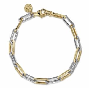 Elegant gold and silver bracelet with alternating links and textured finishes for modern style.