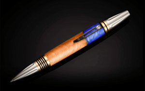 Elegant wooden pen with blue resin and metallic accents on a black background.