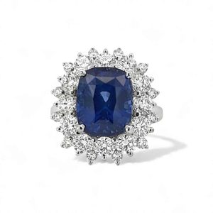 Elegant blue sapphire ring with diamond halo, perfect for engagement or special occasions.
