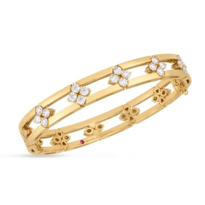 Elegant gold bangle with floral motifs and sparkling stones, perfect for any occasion.