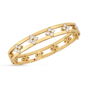 Elegant gold bangle with floral motifs and sparkling gemstones, perfect for any occasion.