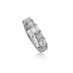 Exquisite diamond ring in polished silver, featuring round and emerald-cut stones for luxurious elegance.