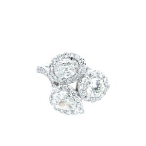 Elegant diamond ring featuring pear-shaped and oval stones with intricate detailing in white gold.