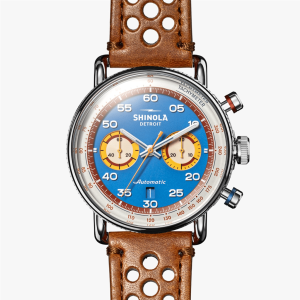 Stylish Shinola chronograph watch with vibrant blue dial and brown leather strap.