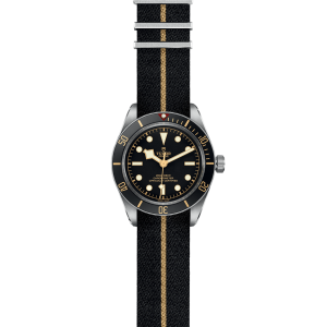 Stylish Tudor diving watch with stainless steel case, ceramic bezel, and black fabric strap.