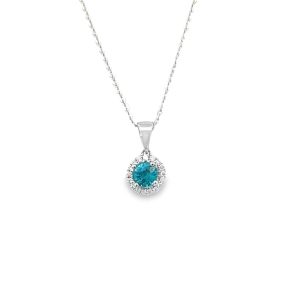 Elegant turquoise pendant necklace with silver chain, featuring sparkling gemstones and sophisticated design.