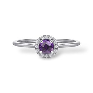 Elegant purple gemstone ring with a sparkling halo of white stones in a luxurious setting.