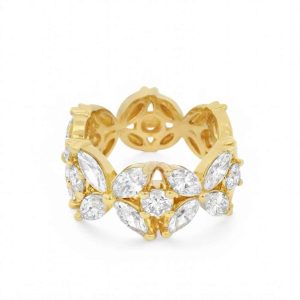 Elegant gold ring with sparkling gemstones in marquise and round shapes, perfect for any occasion.