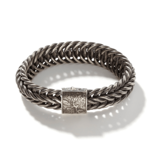 Stylish silver braided bracelet with unique clasp, perfect for everyday elegance and modern design.