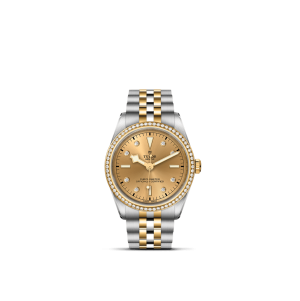 Tudor luxury watch with diamond accents, gold dial, and two-tone bracelet design.