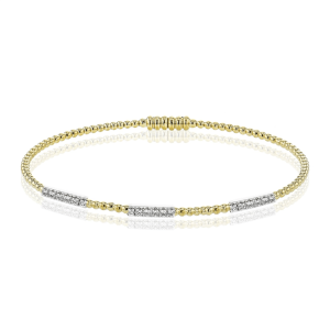 Elegant yellow gold bracelet with white metal sections and sparkling gemstones for luxurious style.