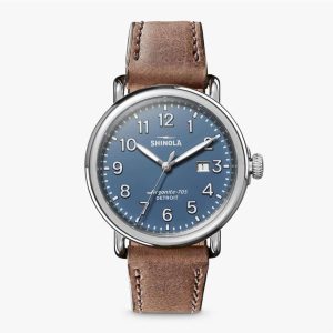 Stylish Shinola watch with blue dial and tan leather strap, perfect for any occasion.