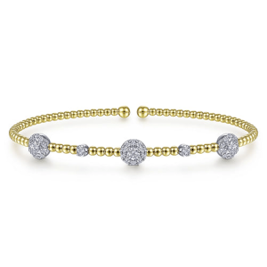 Elegant gold and silver bracelet with sparkling stones, perfect for versatile jewelry styling.
