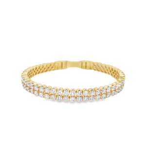 Elegant gold bracelet with sparkling stones, perfect for any occasion, showcasing luxury and craftsmanship.