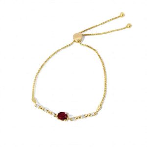 Elegant gold bracelet with a ruby centerpiece and sparkling crystals for a luxurious touch.