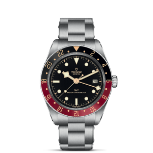 Tudor GMT Master Chronometer watch features a black dial, red and black bezel, and stainless steel bracelet.