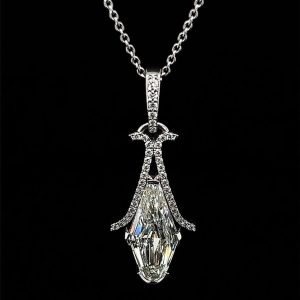 Elegant teardrop pendant necklace with sparkling stones on a sleek chain against a black background.