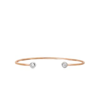 Minimalist rose gold cuff bracelet with silver spheres and sparkling gemstones for elegant style.