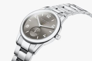 Elegant NOMOS Glashütte watch with polished stainless steel case and sophisticated gray dial.