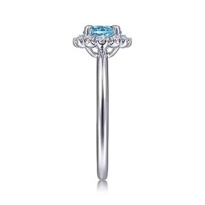 Elegant silver ring with a captivating blue gemstone and diamond accents, perfect for special occasions.