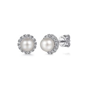 Elegant pearl earrings with sparkling cubic zirconia halo, perfect for any occasion.