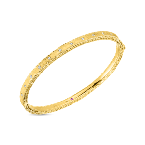 Elegant gold bangle bracelet with sparkling diamonds and intricate design, perfect for any occasion.