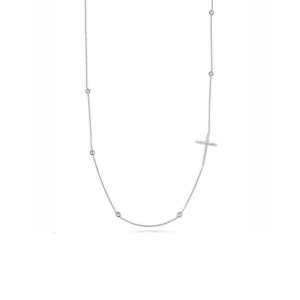 Elegant silver necklace with a cross pendant and sparkling accents for stylish, versatile wear.