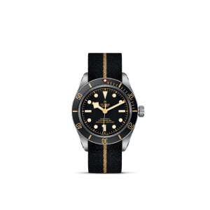 Tudor vintage dive watch features a black dial, luminous markers, and a durable fabric strap.
