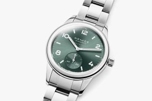Nomos Glashütte stainless steel watch features a green dial and elegant design for modern sophistication.