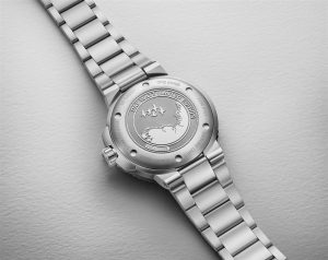 Limited edition ORIS Swiss wristwatch with polished stainless steel bracelet and intricate engravings.
