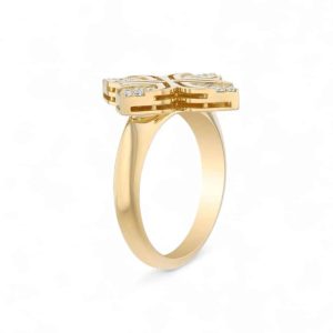 Elegant gold ring with abstract cross design and sparkling stones, perfect for modern jewelry lovers.