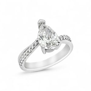 Elegant pear-shaped diamond engagement ring with a sparkling white metal band and intricate side stones.