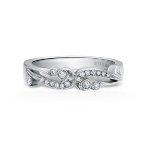 Elegant silver ring with diamonds by Kirk Kara, perfect for engagements or anniversaries.