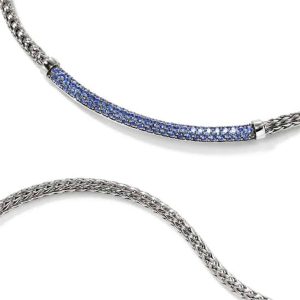 Elegant silver necklace with sparkling blue gems, perfect for formal and casual occasions.