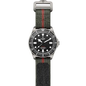 Tudor diving watch with black dial, luminous markers, green fabric strap, and stainless steel bezel.