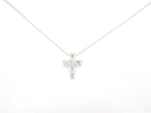 Elegant cross necklace with sparkling pendant on a slender chain, perfect for fashion and faith.