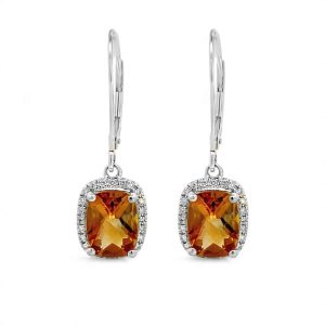 Elegant amber gemstone earrings with diamond halo in a stylish silver setting.