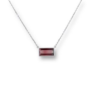 Elegant pink gemstone pendant necklace on a delicate chain, perfect for any occasion.