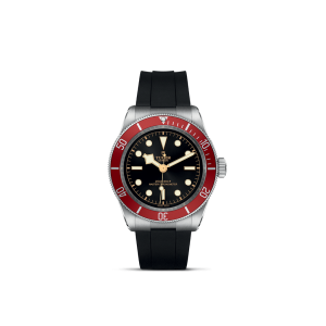 Tudor diving watch with stainless steel case, black dial, red bezel, and rubber strap.