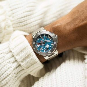 Stylish diving watch on a strong wrist, paired with a cozy white knitted sweater.