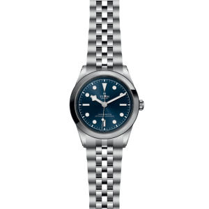 Elegant Tudor watch with blue dial, stainless steel case, and luminescent markers for precision.